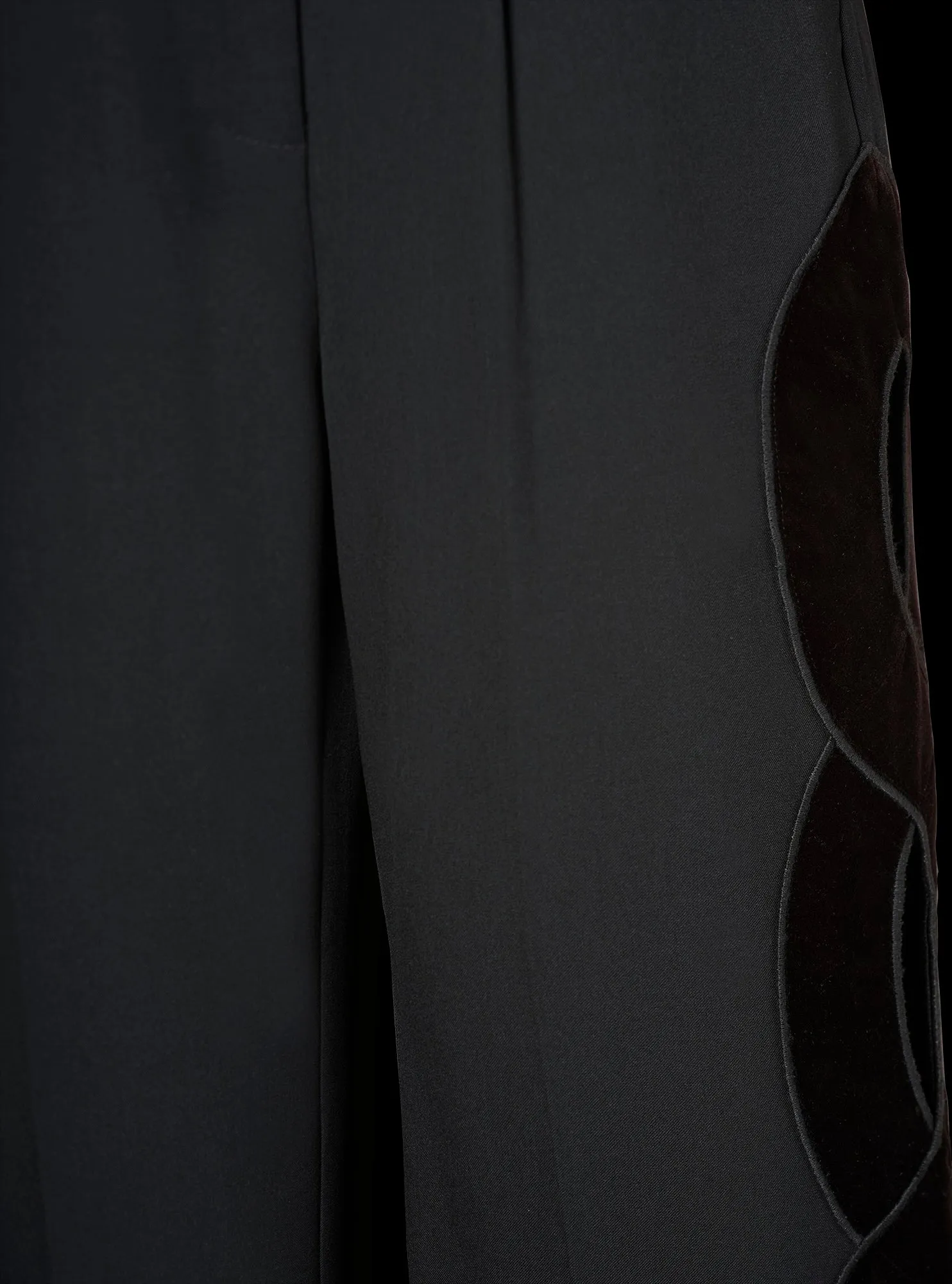 Pantalon avec ouverture tresse